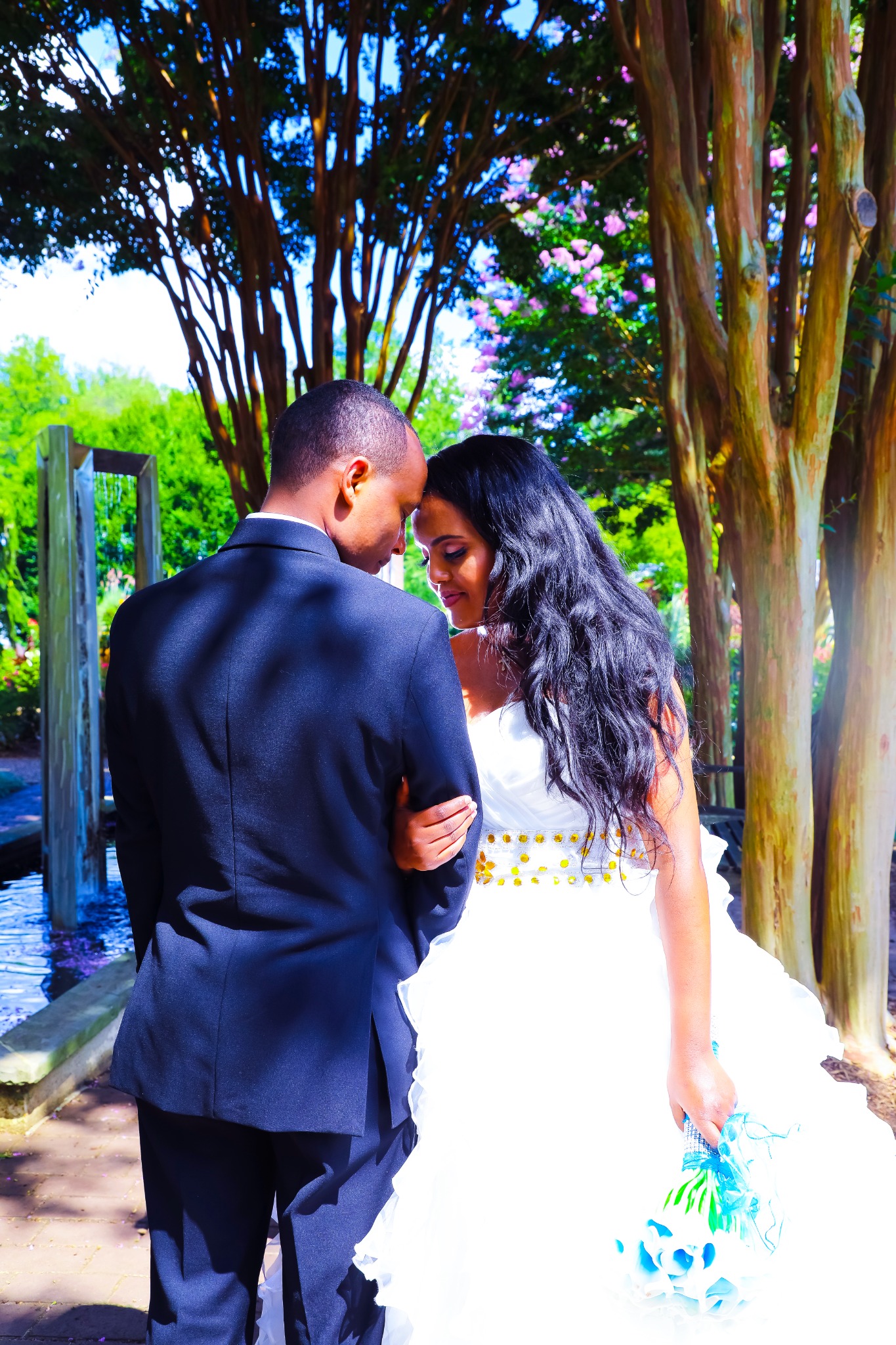 Wedding couple sharing a quiet moment outdoors